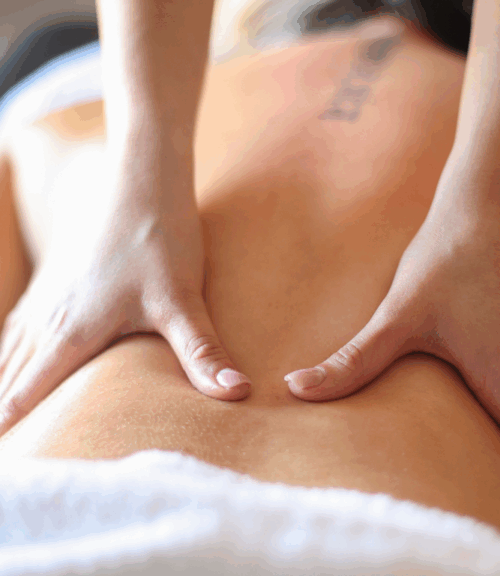 massage preparation | Body First Wellness Center hand on back massage