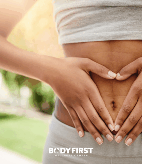 hands holding lower stomach